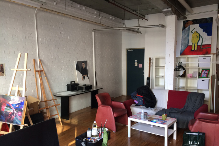 The Illustration Career Launcher Studio, a room with easels, couches and shelves with a painting 