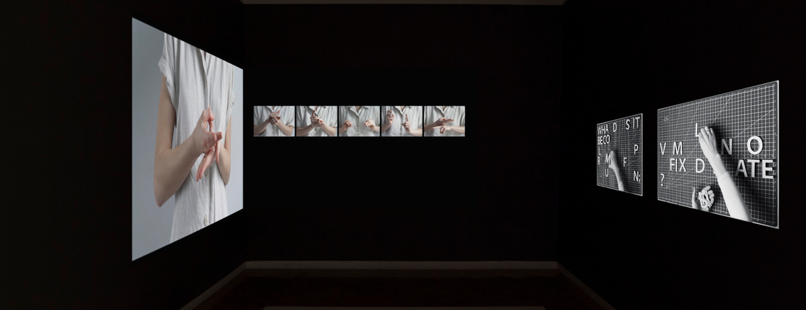 Gallery 44 in the dark gallery displaying projections of Claude Labrèche-Lemay's Proof 26 