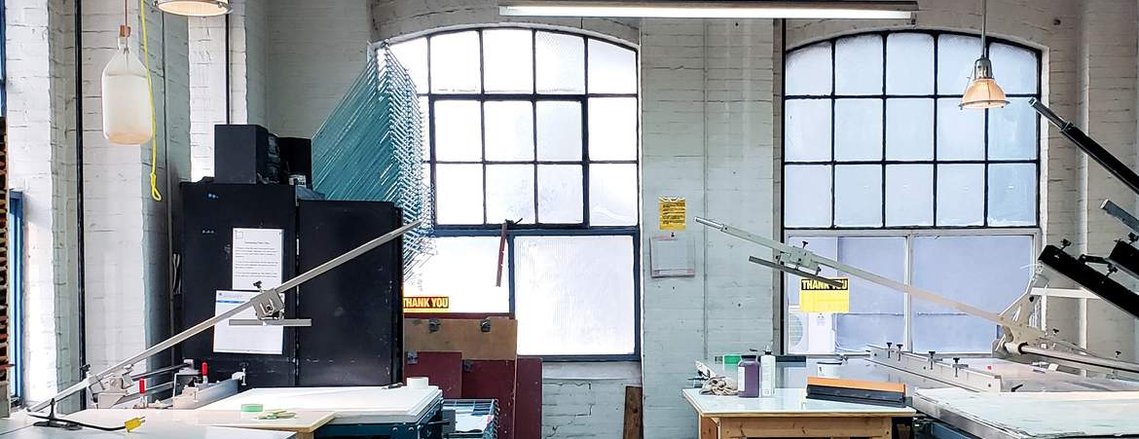 The Open Studio space, with desks and artist equipment 