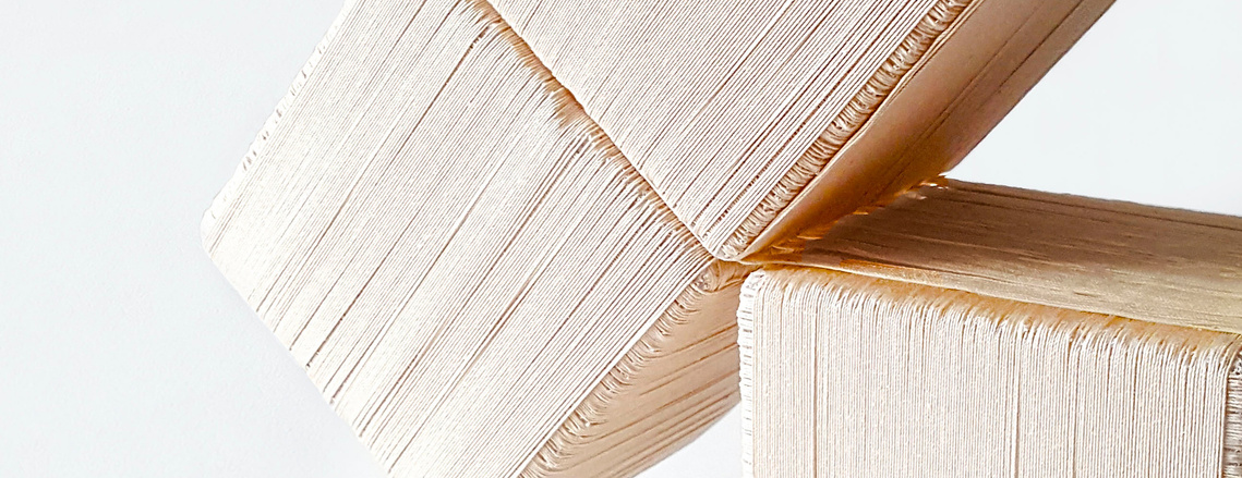 A close up of Charlize Nhung's Transform In Fringe 2.0 installation. Cubes woven out of fiber lean against each other.