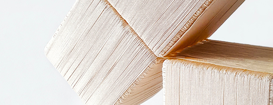 A close up of Charlize Nhung's Transform In Fringe 2.0 installation. Cubes woven out of fiber lean against each other.