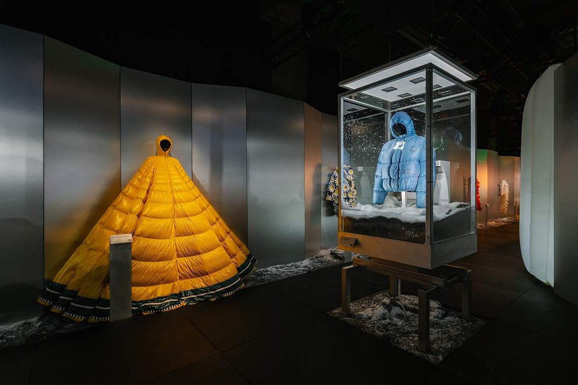 various pieces of clothing exhibited in cabinets or on mannequins