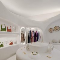 store interior made of dimly lit white ceramic curves.