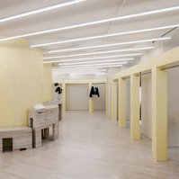 roman travertine floor and furniture with glossy yellow metal structures.