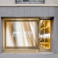 gold colours store entrance next to a screen showing a gold fabric animation.