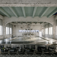 table made of kitchen sinks and metal set inside a construction site