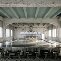 table made of kitchen sinks and metal set inside a construction site
