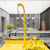 refurbished industrial sink painted yellow set in an all steel coloured jewellery store