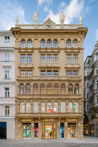 1850s store facade in daylight with window displays on the ground floor