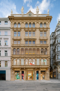 1850s store facade in daylight with window displays on the ground floor