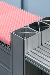 close-up of a bench made of aluminum profile and pink foam.