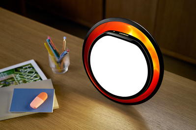 A vibrant Lumie lamp on an office table. 