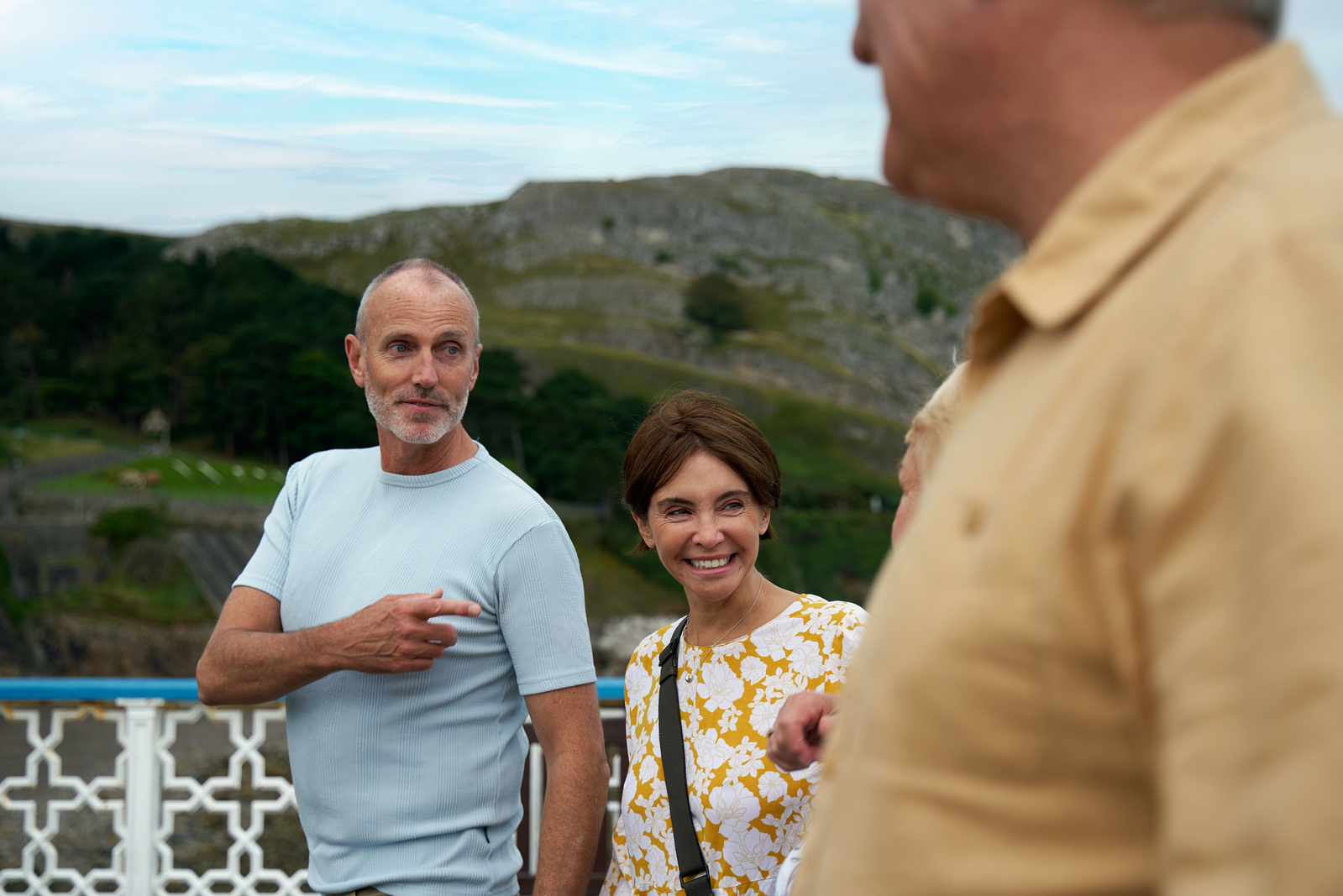 a group of people on a boat talking to each other