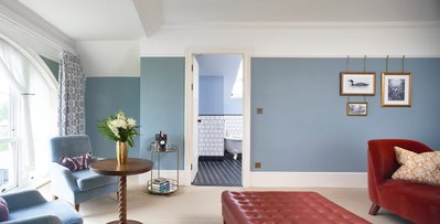 A bright and airy hotel room. 