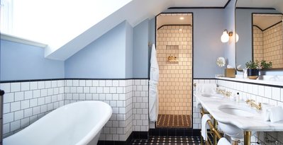 A bright and airy hotel bathroom. 