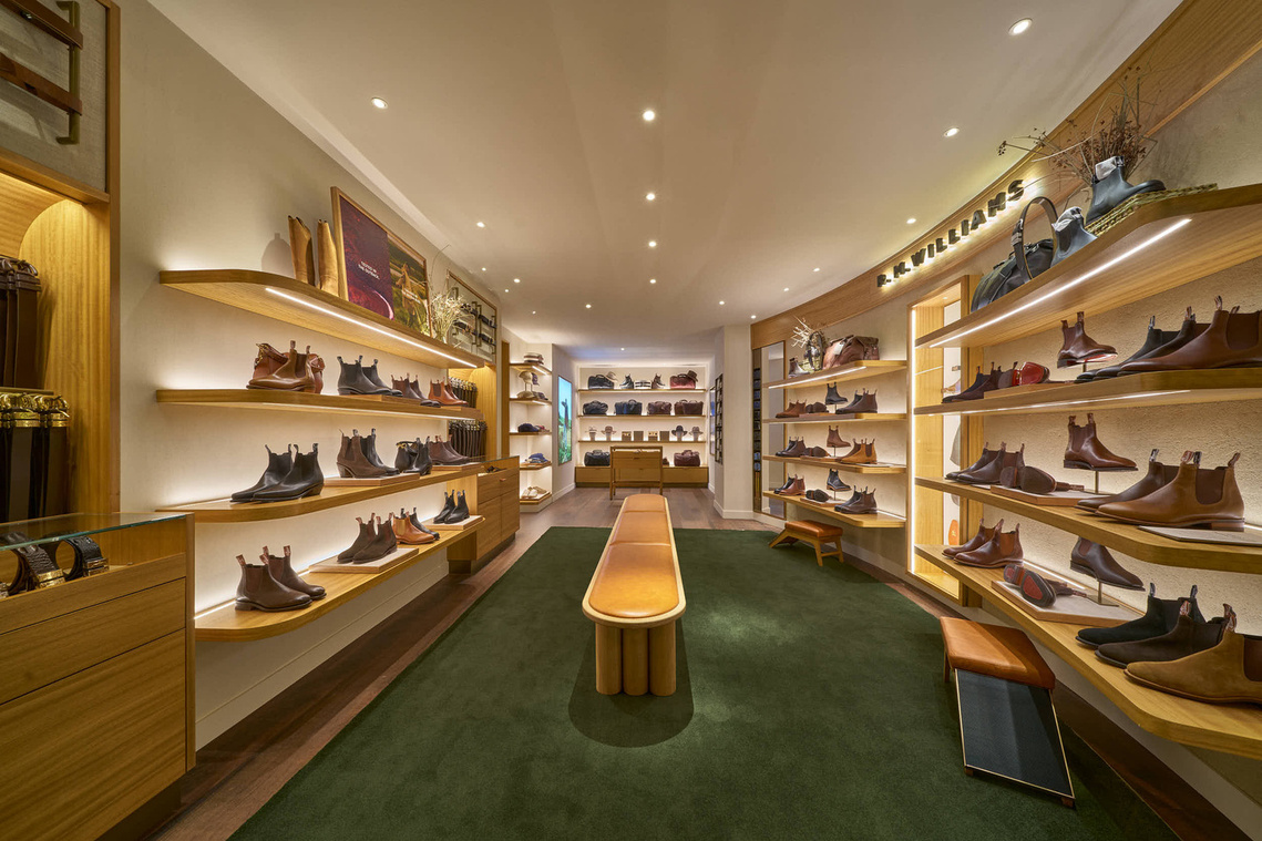 the inside of a shoe store with many different types of shoes