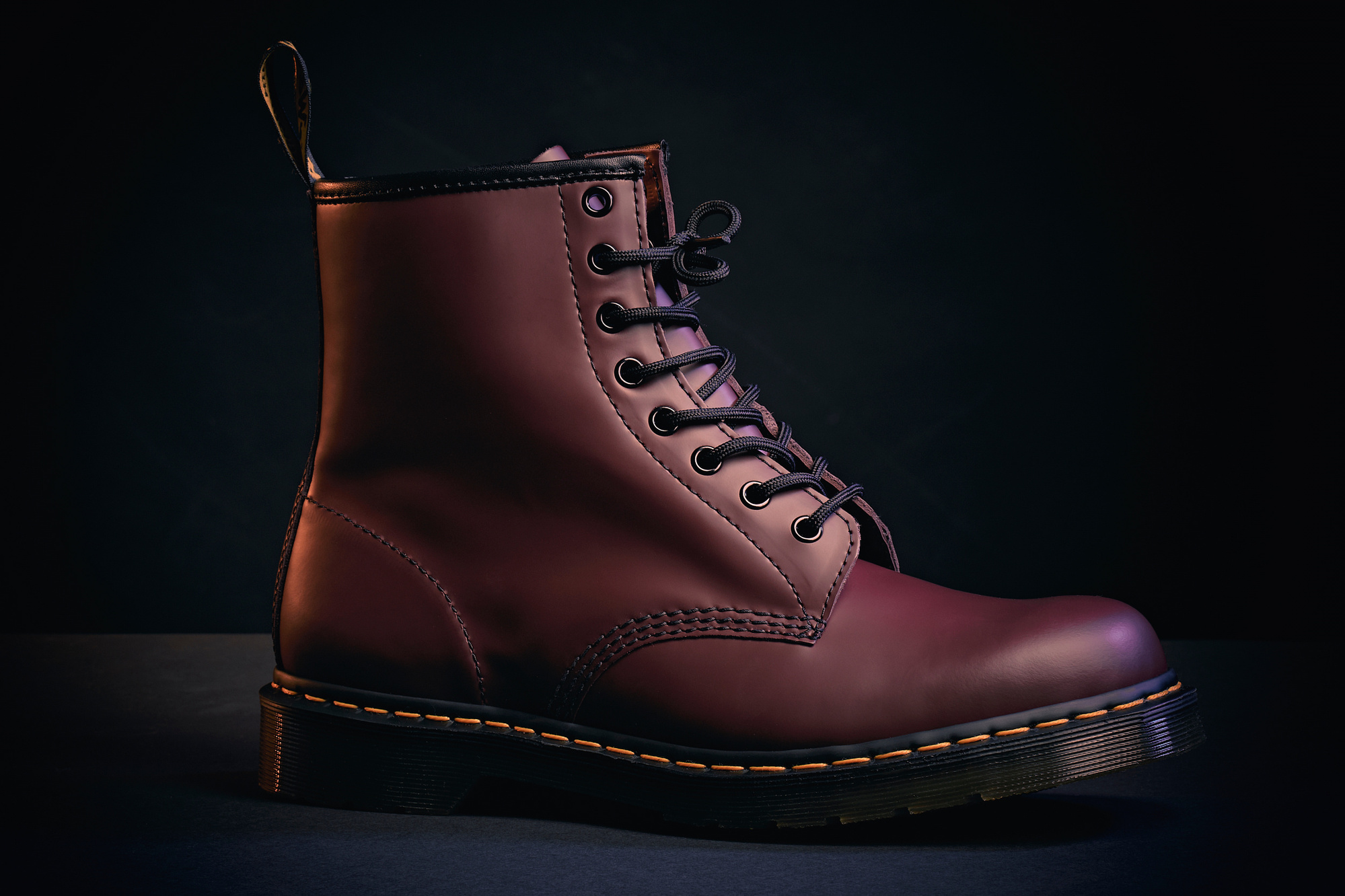 stylish and cinematic product shot of a Dr Martens 1460 red boot. 