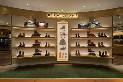 An interior photograph of a mens shoe shop. 