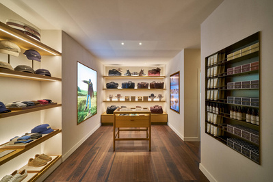 An interior photograph of a mens shoe shop. 