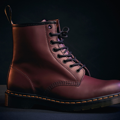 stylish and cinematic product shot of a Dr Martens 1460 red boot. 