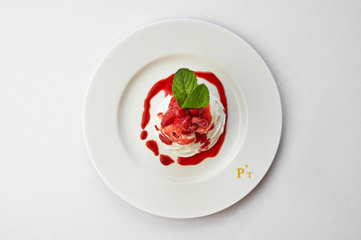 A vibrant dessert photographed on a white background. 