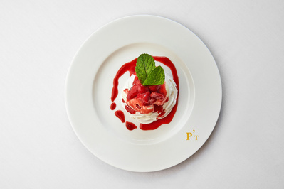 A vibrant dessert photographed on a white background. 
