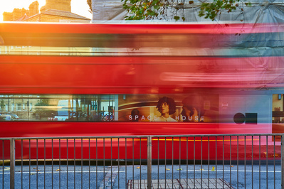A slow shutter photograph of a blurry London bus. 