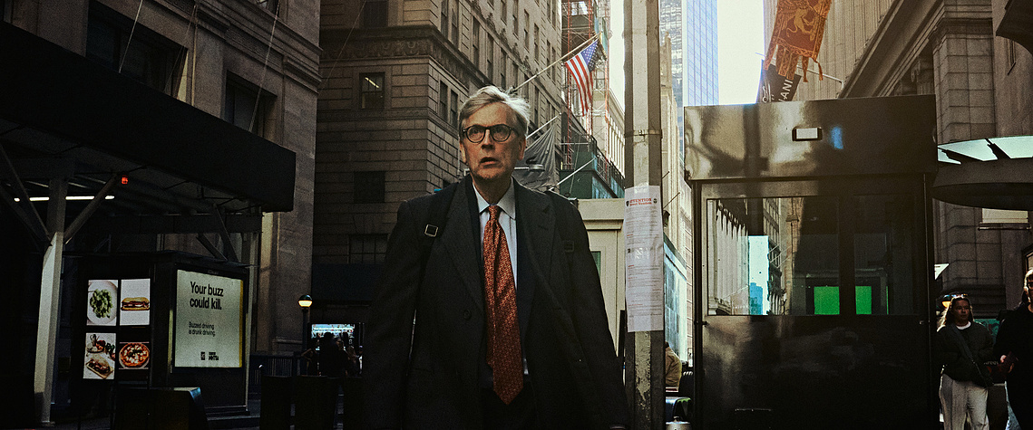 A New York city businessman walking the streets. 