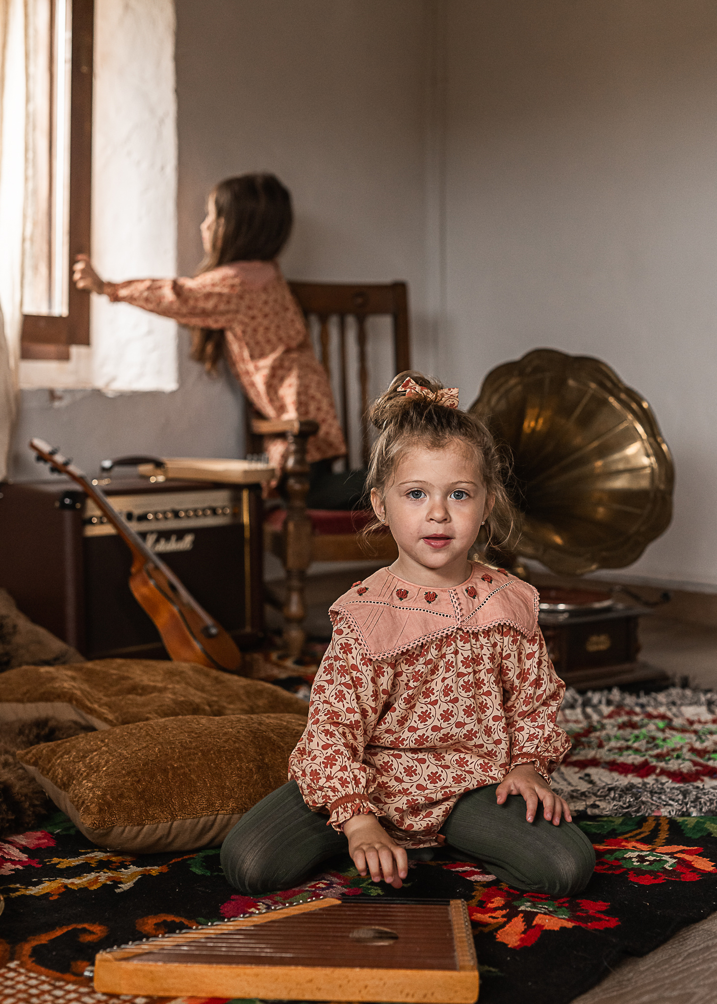 dos niñas con instrumentos en una Masia del Pla de l'Estany, girona, spain