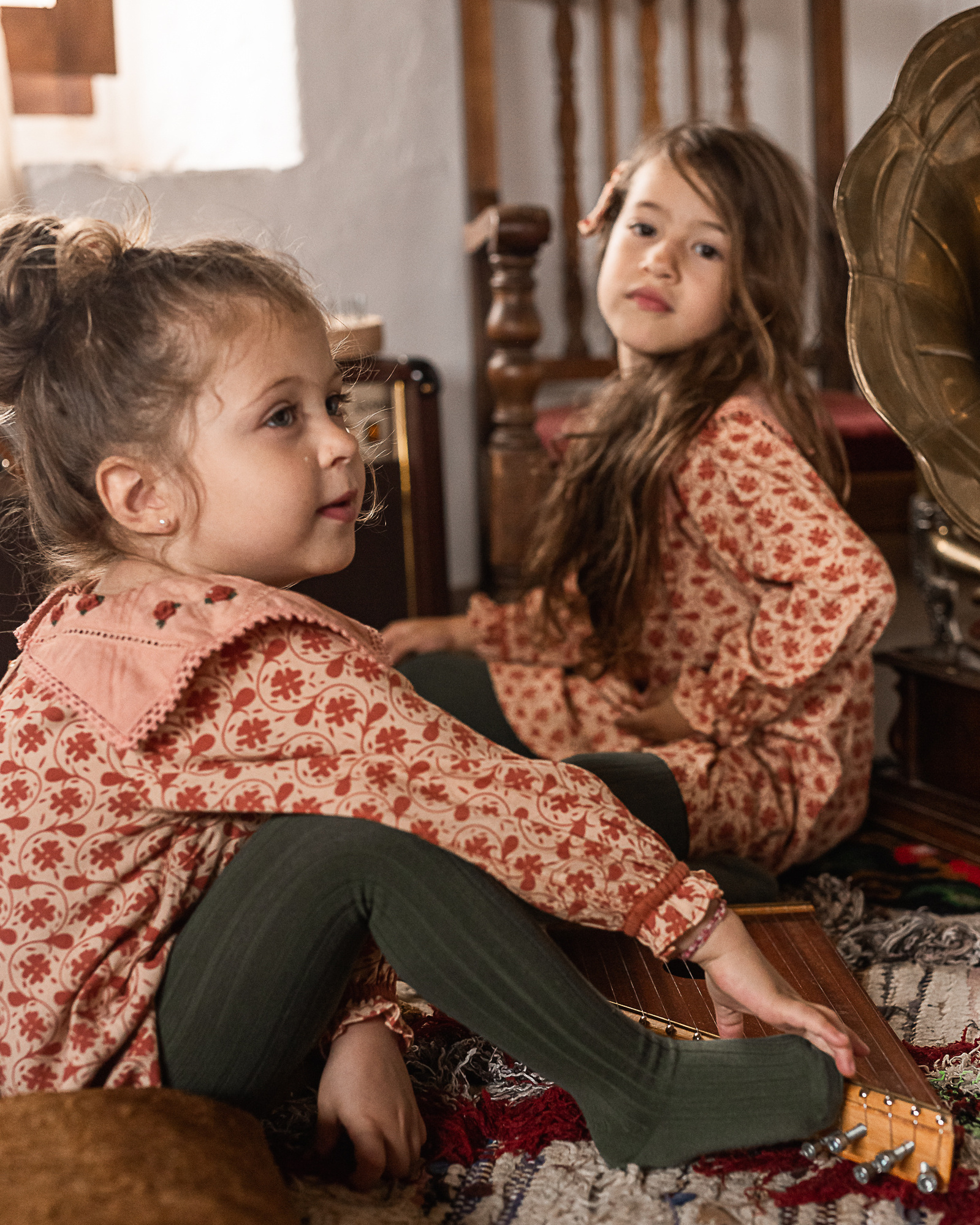 dos niñas con instrumentos en una Masia del Pla de l'Estany, girona, spain