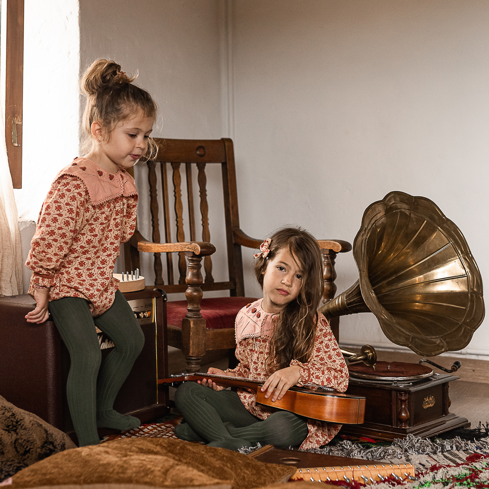 dos niñas con instrumentos en una Masia del Pla de l'Estany, girona, spain