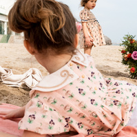 dos niñas disfrutando de la playa  SS 2022 campaign for the kids fashion brand Bachaā at platja de les casetas, Garraf, Spain 