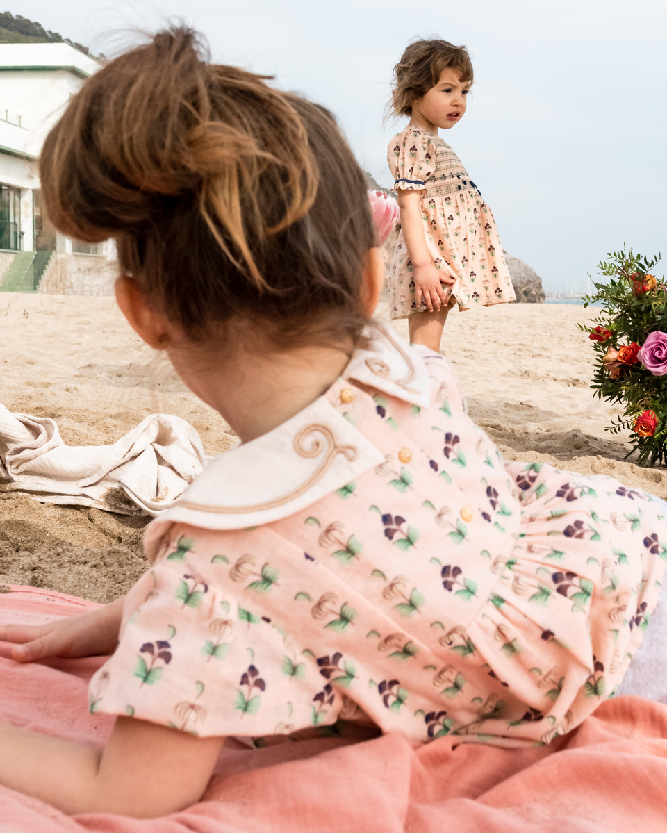 dos niñas disfrutando de la playa  SS 2022 campaign for the kids fashion brand Bachaā at platja de les casetas, Garraf, Spain 