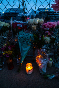 Candle and flowers left in tribute to victims outside of King Soopers on Table Mesa in Boulder, CO. (Io Hartman&amp;amp;#x2F;CU Independent)