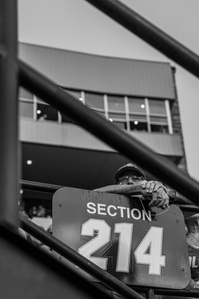 A man sits in Folsom Field's stands onlooking CU Boulder's first football game of the season.
