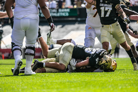 Nate Landman (53) tackles an opposing player to the ground during the game against Minneapolis on September 18th, 2021. (Io Hartman&#x2F; CU Independent)