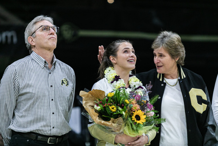 Senior defensive specialist Taylor Deprosse (3) cries while standing with her parents during the senior ceremony at the game against the Washington Huskies on Wednesday, Nov. 24, 2021. (Io Hartman&#x2F;CU Independent)