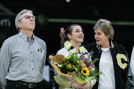 Senior defensive specialist Taylor Deprosse (3) cries while standing with her parents during the senior ceremony at the game against the Washington Huskies on Wednesday, Nov. 24, 2021. (Io Hartman&#x2F;CU Independent)
