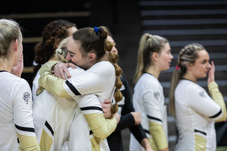 Senior outside hitter Zoe Neverdowski (5) hugs her teammates during the senior ceremony at the game against Washington Huskies on Wednesday, Nov. 24th, 2021. (Io Hartman&#x2F;CU Independent)