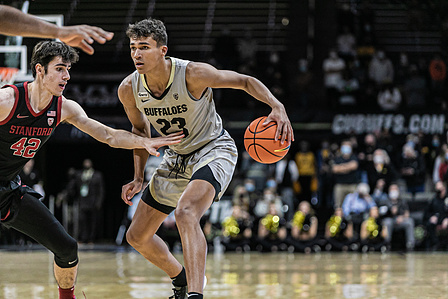 Sophomore forward Tristan Da Silva guards the ball against a Stanford player during the game at the CU Events Center. on Sunday, Nov. 28th, 2021. (Io Hartman&#x2F;CU Independent)