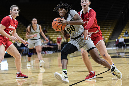 Junior guard Jaylyn Sherrod (00) controls the ball during the game against Dixie State on Friday, Dec. 3rd, 2021. (Io Hartman&#x2F;CU Independet)