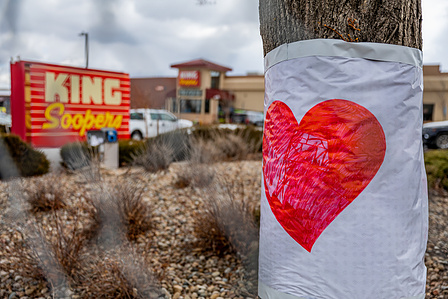A heart drawn on paper taped to a tree in front of King Soopers on Table Mesa in Boulder, CO on Tuesday, March 23, 2021. (Io Hartman&amp;amp;amp;#x2F;CU Independent)