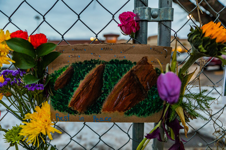 Cardboard painting made in tribute to victims hangs outside King Soopers on Table Mesa in Boulder, CO. (Io Hartman&amp;amp;#x2F;CU Independent)