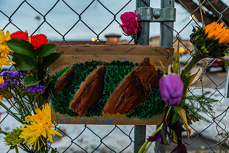 Cardboard painting made in tribute to victims hangs outside King Soopers on Table Mesa in Boulder, CO. (Io Hartman&amp;amp;amp;#x2F;CU Independent)