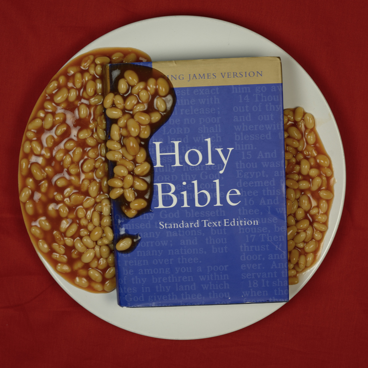 plate with blue bible served with baked beans