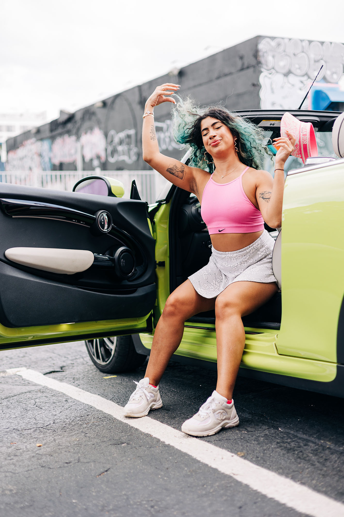 miami photoshoot at wynwood walls with colorful mural and lime green mini cooper car and fashion model barbie theme photoshoot 