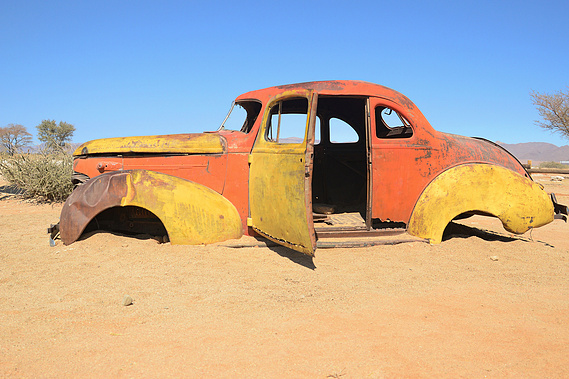 Rusted old cars at Solitaire, a small rural settlement in the Khomas Region of central Namibia. This small village can be found near the Namib-Naukluft National Park. Elements of Nature Curation, by photographer Lizane Louw. 