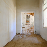 "Portraits of Time" Fine Art Photography Collection. Kolmanskop, Namibia. A work from the collection created at Kolmanskop by photographer, Lizane Louw. An image of an abandoned building in the diamond mining village in the Namib.