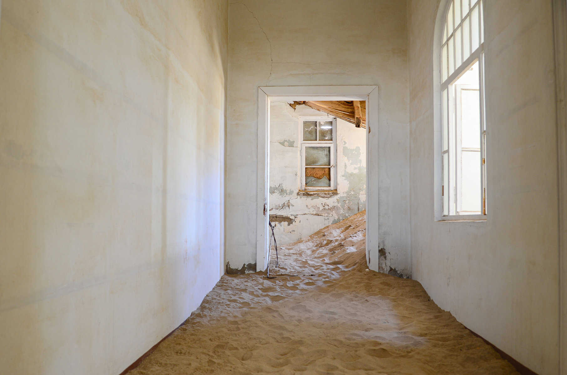 "Portraits of Time" Fine Art Photography Collection. Kolmanskop, Namibia. A work from the collection created at Kolmanskop by photographer, Lizane Louw. An image of an abandoned building in the diamond mining village in the Namib.