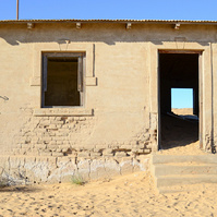 "Portraits of Time" Fine Art Photography Collection. Kolmanskop, Namibia. A work from the collection created at Kolmanskop by photographer, Lizane Louw. An image of an abandoned building in the diamond mining village in the Namib.